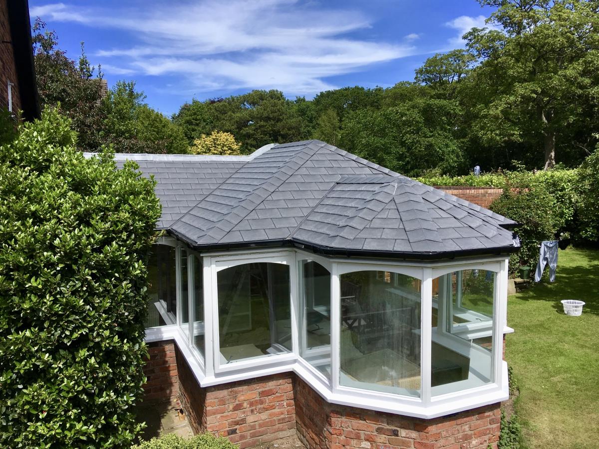 Solid roof in grey tapco slate style for an interesting Lytham conservatory.