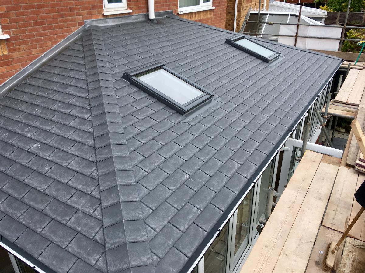 Top view of an installation with velux windows on a slate style conservatory roof.