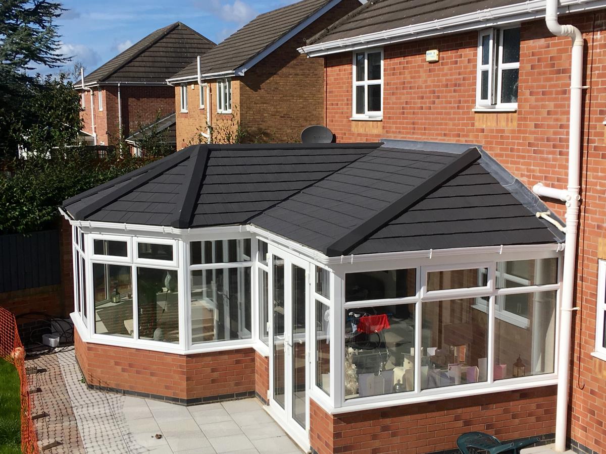 Ebony metrotile shingle solid roof conversion for a P-shaped conservatory in Norcross, Blackpool.