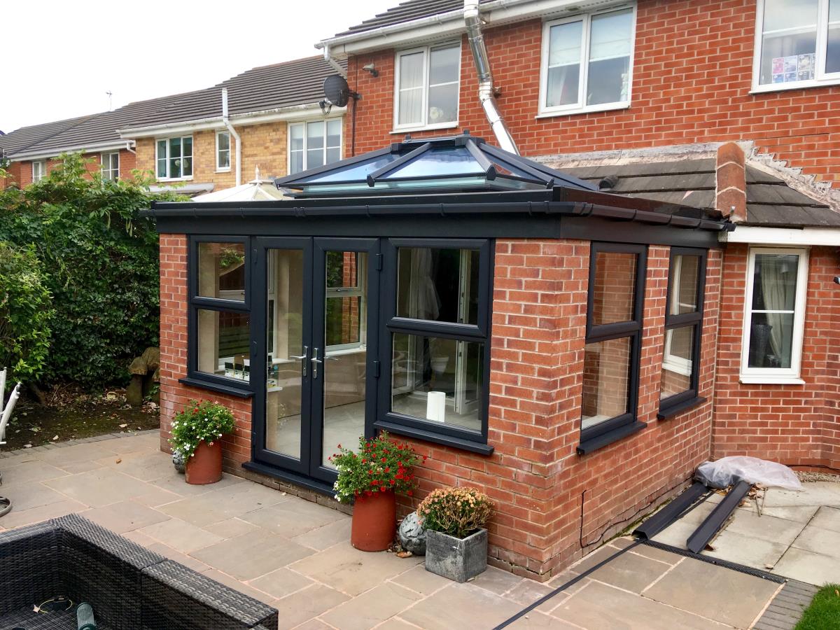 An orangery in Poulton-le-Fylde with an anthracite flat roof and lantern.