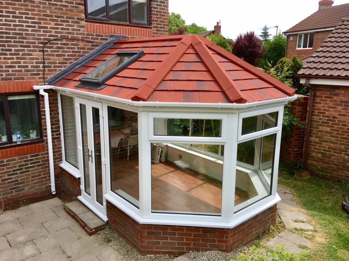 Antique red conservatory roof for five sided garden room with velux windows in Cleveleys.