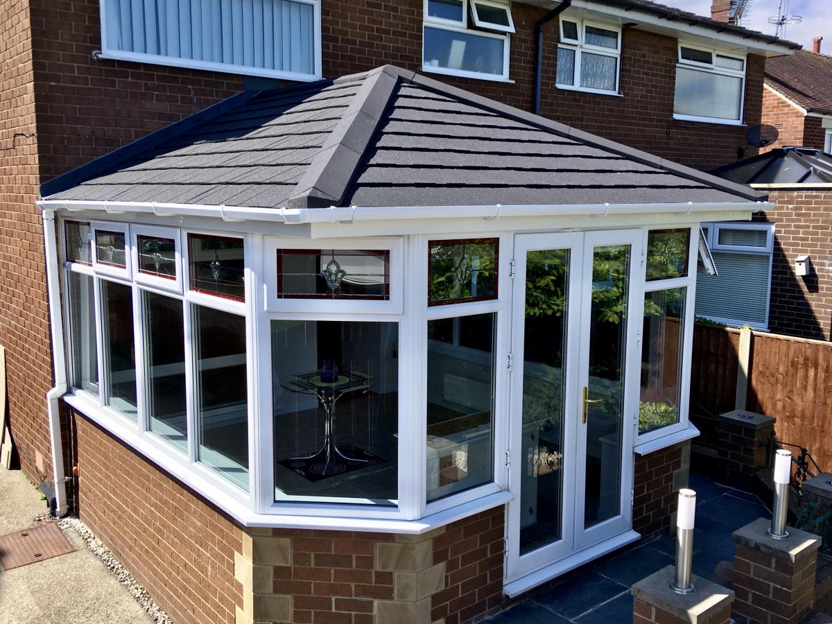 Ebony metrotile solid roof conversion for a Georgian style conservatory in Kirkham.