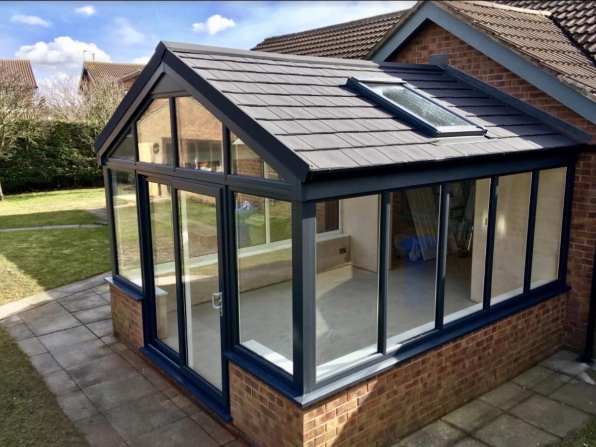 A gable fronted metrotile roof conversion with velux window for a Poulton-le-Fylde conservatory.