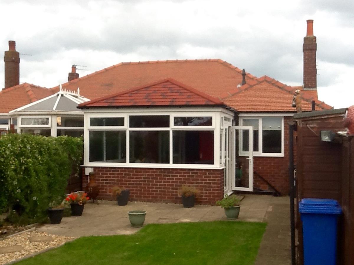 Antique red shingle style roofing for a Cleveleys conservatory, replacing the original glass.
