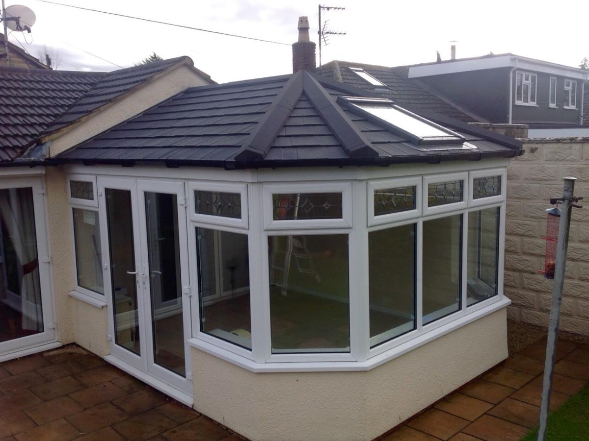 Ebony coloured Victorian style conservatory roof conversion for a Fleetwood home.