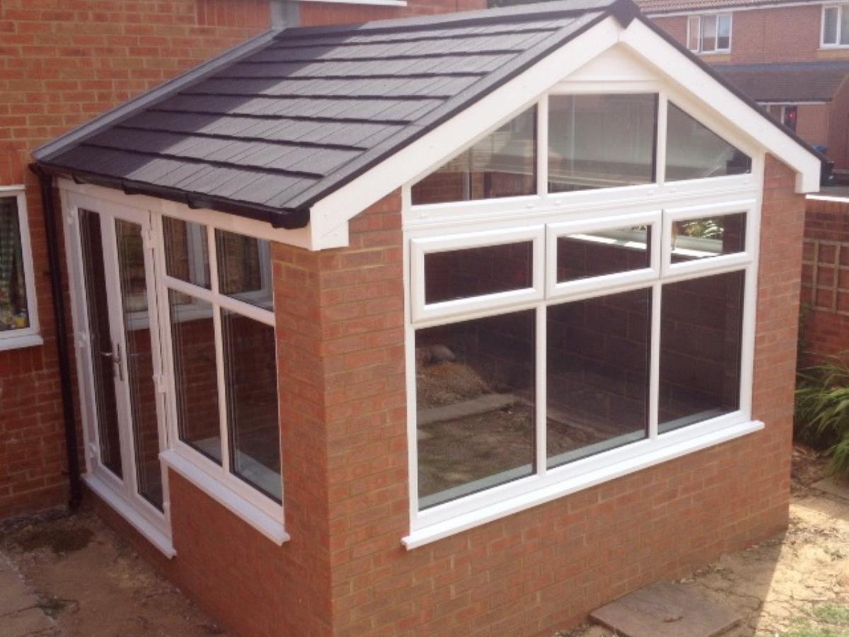 Gable fronted ebony shingle style tiled roofing for a St Annes conservatory.