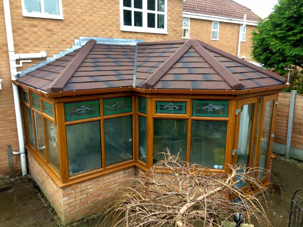 P-shaped burnt umber solid tiled conservatory roofing for a Thornton client.